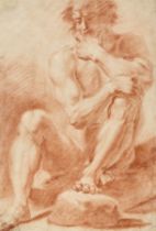 Follower of Annibale Carracci,  Italian 1560-1609-  Study of a seated male nude;  red chalk on ...