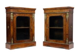 A pair of Victorian gilt-metal mounted marquetry and walnut pier cabinets, third quarter 19th cen...