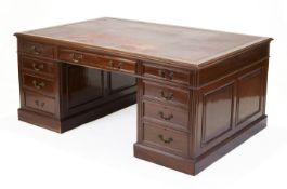 A mahogany partners desk, of George III style, third quarter 20th century, the rectangular top in...