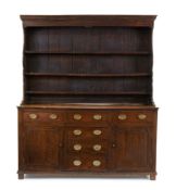 A George II oak dresser, second quarter 18th century, with associated plate rack above six drawer...