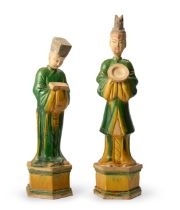 A pair of Chinese Ming-revival yellow and green-glazed pottery figures Late Qing/Republic period...