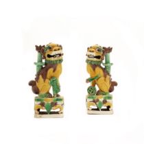 A pair of Chinese famille verte on biscuit 'Buddhist lions' incense holders Qing dynasty, Kangxi...