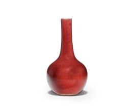 A Chinese copper-red-glazed bottle vase Republic period Covered overall on the exterior in a ri...