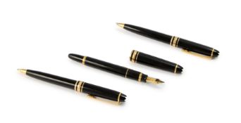 Montblanc. A set comprising fountain pen, rollerball pen and pencil, all in black resin, with gil...
