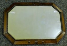 An early 20th century oak-framed bevelled mirror. 88 x 60 cm.