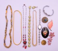 A quantity of costume jewellery. Leaf brooch 6 cm long.
