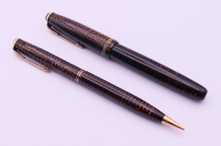 A Parker Vacumatic fountain pen with 14 K gold Parker nib and a matching Parker Vacumatic