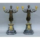A pair of bronze Empire-style twin-branch candelabra. 52 cm high.