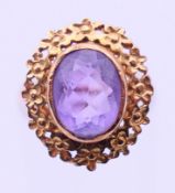 An unmarked gold and amethyst ring. Ring size M. 3 grammes total weight.