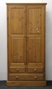A tall shelved pine cupboard with two lower drawers. 100 cm wide x 206 cm high.