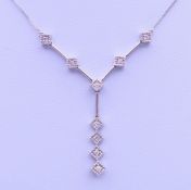 A 9 ct white gold and diamond pendant necklace. Pendant drop 3 cm high, chain 45 cm long. 3.