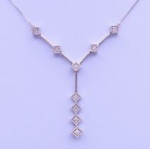 A 9 ct white gold and diamond pendant necklace. Pendant drop 3 cm high, chain 45 cm long. 3.