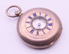 A silver half hunter pocket watch. 3.5 cm diameter.