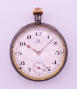 A small steal cased Omega pocket watch. 3.2 cm diameter.