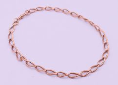 A 9 ct gold watch chain. 42 cm long. 30.1 grammes.