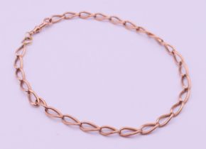 A 9 ct gold watch chain. 42 cm long. 30.1 grammes.