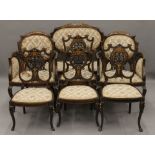 An Edwardian ivory inlaid mahogany salon suite comprising a settee,