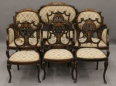 An Edwardian ivory inlaid mahogany salon suite comprising a settee,