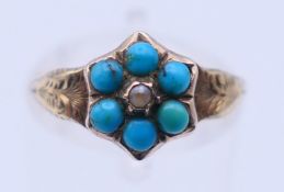 An unmarked antique 9 ct gold and turquoise ring. Ring size N. 1.4 grammes total weight.
