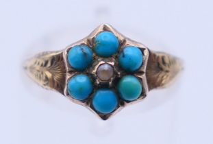 An unmarked antique 9 ct gold and turquoise ring. Ring size N. 1.4 grammes total weight.