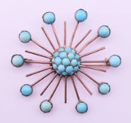A turquoise set brooch. 5 cm diameter.