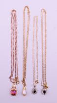 Four 9 ct gold pendant set necklaces. Pearl drop pendant 1.