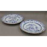 A pair of 18th century Chinese blue and white porcelain chargers. Each 40 cm diameter.
