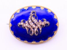 A 19th century diamond and blue enamel mourning brooch. 3.5 x 2.75 cm.