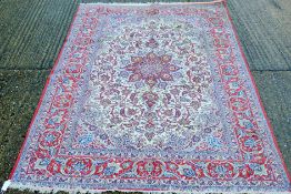 A Persian handmade Isfahan carpet. 240 x 162 cm.