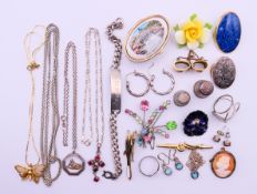 A quantity of costume and silver jewellery to include brooches, necklaces, earrings,