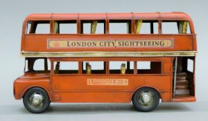 A tinplate model of a London bus. 28 cm long.