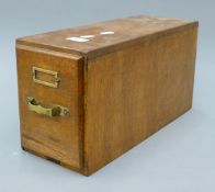 A vintage oak filing drawer. 16 cm wide x 41 cm deep.