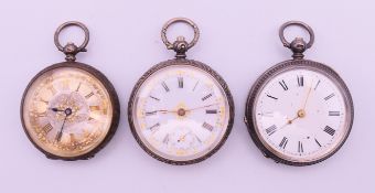 Three silver pocket watches. The largest 3.75 cm diameter.