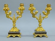 A pair of gilt bronze mermaid-form candelabra. Each 28 cm high.