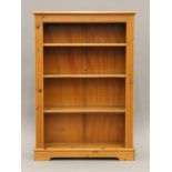 A modern pine bookcase. 83 cm wide x 122 cm high.