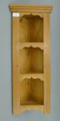 A small modern pine corner shelf. 26.5 cm wide x 67 cm high.