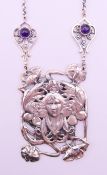 An Art Nouveau style girl form pendant necklace. pendant 6 cm high.