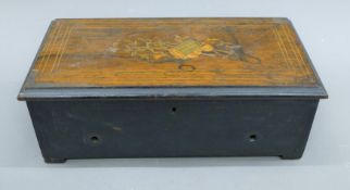 A 19th century inlaid music box. 34.5 cm wide.