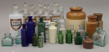 A collection of various bottles and Victorian apothecary jars etc. The largest 19.5 cm high.