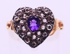 A gold, diamond and amethyst heart ring. Ring size N/O.