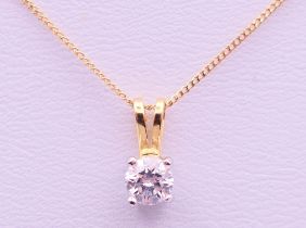 A diamond set gold pendant on an 18 ct gold chain.