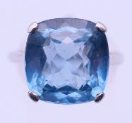 A platinum and aquamarine ring. Ring size R/S. 5.2 grammes total weight.