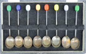 A cased set of silver coffee bean spoons. The case 18.5 cm wide. 48.7 grammes total weight.