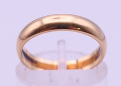 A 9 ct gold wedding band. Ring size L. 2.3 grammes.