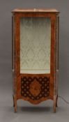 A Serpentine-fronted display cabinet. 158.5 cm high x 77 cm wide.