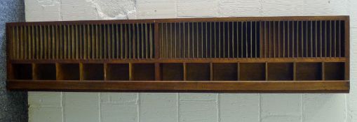 A large mahogany pigeon holes unit. 179 cm long x 40 cm high.