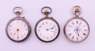 Three silver fob watches. Each 3 cm diameter.