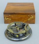 A boxed sundial compass. The box 12.5 cm wide.