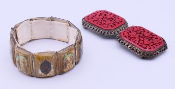 A cinnabar buckle and a bracelet. The former 9 cm long.