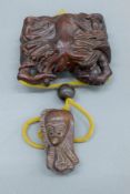 A hardwood crab and octopus inro. 8 cm wide.